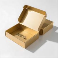 Boîtes d'expédition colorées à motifs dorés exquis de marque avec gaufrage et matériaux recyclables pour l'emballage de vêtements