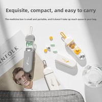 Boîte à pilules multi-compartiments moulée par injection, étanche, design compact en forme de capsule, suspendable pour porte-clés/sac pour les voyages et le travail