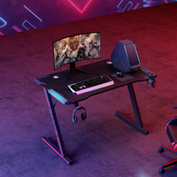 Prix de gros de haute qualité Cool RGB Light Bureau de jeu en forme de Z Grand bureau d'ordinateur noir Table de jeu pour bureau à domicile pour PC