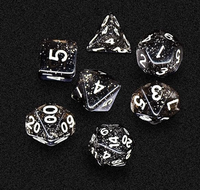 Dés polyédriques noirs mouchetés d'étoile de résine avec la numérotation blanche pour des jeux de rôle de table