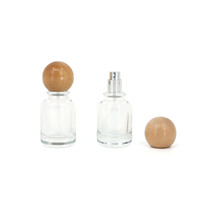 Flacons de parfum vides en verre transparent de 30 ml avec pompe à vaporisation fine ronde, design unique, logo personnalisé, avec couvercle en bois sphérique