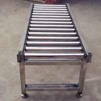 Ligne d'assemblage à rouleaux électriques en acier inoxydable avec bande transporteuse et tables de travail