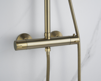 Nouvel ensemble de douche de pluie thermostatique ronde de salle de bain complète fixée au mur exposée en or brossé avec douchette