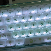 Clavier transparent 68 touches avec touches imitation céramique, mode triple connexion 2.4G/BT/Filaire, rétroéclairage RGB, hot-swappable, service OEM/ODM