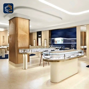 การออกแบบตกแต่งภายในร้านขายนาฬิกาและเครื่องประดับสุดหรู <span class=keywords><strong>ตู้</strong></span>โชว์กระจกโค้ง กรอบโลหะสีทอง พร้อมเคาน์เตอร์กลางรูปทรงเกาะ - Product Image 5