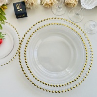 Assiettes de présentation en verre transparent de 13 pouces en forme de pétale avec bordure dorée ou argentée pour la décoration de tables de mariage, banquets et fêtes - Vente en gros
