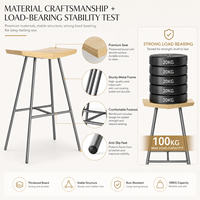 Tabouret de bar de style industriel en métal noir mat avec pieds évasés et repose-pieds, 65 cm, pour comptoir de cuisine ou pub