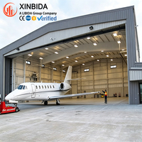 Hangar d'avion en acier à ossature large, atelier d'entretien de jets privés, entièrement fermé, panneaux extérieurs résistants aux intempéries