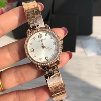Montre pour femme avec lunette en cristal, cadran en nacre or rose, grands chiffres, élégante, à quartz, résistante à l'eau, cadeau