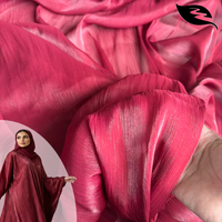 Éclat du coucher de soleil rubis : Organza luxueux à l'éclat métallique avec texture ondulée pour abayas de haute couture