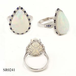 Anillo de oro de 14 quilates con gemas: Ópalo (pera) de 8.33 CT, Zafiro azul (redondo) de 0.32 CT, Diamante blanco (redondo) de 0.24 CT - Product Image 1