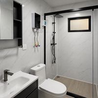 Maison conteneur noire mate préfabriquée, cabane modulaire avec bande lumineuse LED, double porte vitrée, villa avec terrasse sur la plage