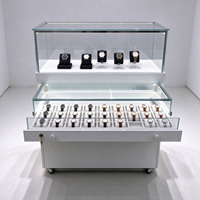 Comptoir de présentation roulant blanc pour magasin de montres avec vitrine en verre, plateaux grillagés et tiroirs verrouillables CE ETL pour boutique de montres