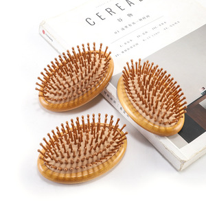Cepillo de masaje capilar de madera de nanmu con cojín elástico para el cuidado de los meridianos de la cabeza y un cabello suave - Product Image 2
