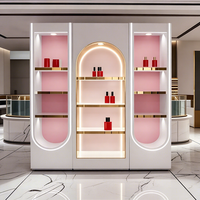 Vitrine de magasin de parfums et cosmétiques de luxe moderne haut de gamme en acier inoxydable avec éclairage LED, design écologique, dimensions personnalisables