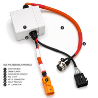 Ensemble de faisceaux de câbles haute tension pour bus électrique avec connecteur HV orange, conduit ondulé et boîte de jonction