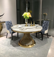 Table à manger ronde moderne de 51 "avec dessus en marbre et piédestal en acier inoxydable doré pour 6 places dans le salon salle à manger hôtel