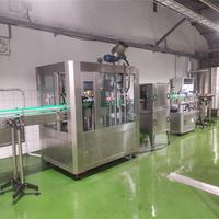 Machine de remplissage et de bouchage semi-automatique pour bouteilles en verre à 8 têtes