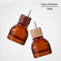 Botol Minyak Esensial Kosong Bentuk Persegi Amber 30ml Kelas Atas Baru dengan Penutup Kayu Bambu untuk Kemasan Cairan Esens