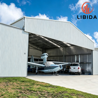 Hangar d'avion à ossature métallique à travée large sur mesure, construction en acier antisismique pour le stationnement et la réparation d'avions à l'aéroport