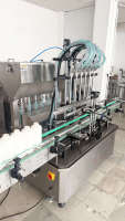 Machine de remplissage de liquides entièrement automatique à 6 buses avec pompe à engrenages, contrôle servo et buses anti-goutte pour huile, sauce, lotion et semi-fluides en bouteille