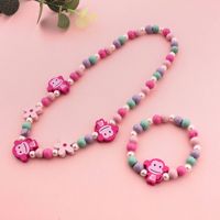 Ensemble de bijoux DIY faits à la main pour enfants, motif singe à grandes oreilles et perles en bois fleuries, bracelet et collier animaux de dessin animé, couleur Yiwu