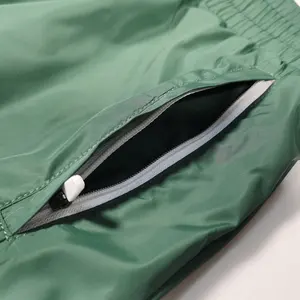 OEM Design Wholesale 100% Nylon Jogger Mens Track Pants Solid Color Pocket Windbreaker Pants