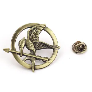 ขายร้อนแฟชั่นเข็มกลัด Lapel Pin The Hunger เกม Lapel Pin ป้ายออกแบบที่กำหนดเอง Lapel Pin