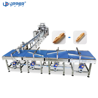 Ligne d'alimentation, de tri et d'emballage automatique pour pain baguette long |   Machine d'emballage automatique pour pain en paine, avec système de mise en filetage et de conditionnement en flux continu