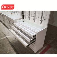Présentoir mural LED verrouillable pour lunettes de soleil et de vue avec tiges optiques en verre trempé - Marque OUYEE - Garantie 3 ans