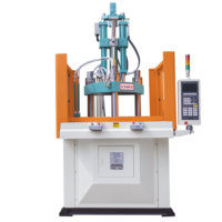 Machine de moulage par injection verticale à table rotative pour l'insertion de composants électroniques (transistors et puces)