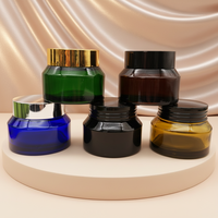 Bouteille en verre borosilicate personnalisable en forme d'épaule pour sérum de soin de la peau. Pompes pulvérisatrices compatibles avec les couvercles. Capacités multiples