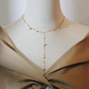 Collar de cadena tipo lariat en forma de Y de moda, chapado en oro de 18 quilates, de acero inoxidable, con colgante de bola delicado y borla larga, para mujer, ideal para fiestas y vestidos. - Product Image 1