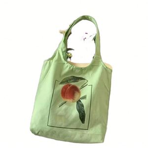 Popular Stylish Reusable Minimalist Peach Print Washable <b>Sturdy</b> Material Canvas <b>Tote</b> <b>Bag</b> for Outdoor Activities - Product Image 1