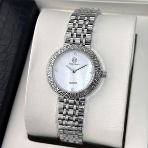 The new ladies' wristwatch features a high-quality mother-of-pearl <b>face</b> and a steel band. It is also water-resistant. - Product Image 1