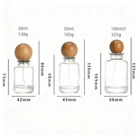 Flacon de parfum de luxe de haute qualité, 30 ml, 50 ml, 100 ml, en verre transparent brillant, à la mode, personnalisable, avec couvercle en bois, impression sérigraphique