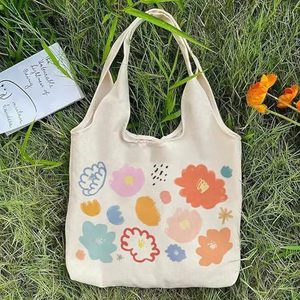 Bolso de playa de lona de algodón con tirantes y estampado floral, estilo camiseta sin mangas, para compras y excursiones, de moda y ecológico. - Product Image 4