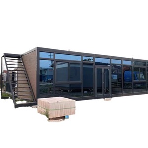 Casa Contenedor Moderna Rectangular para Uso Hotelero con Paredes de Vidrio y Escaleras para Espacio de Vida al Aire Libre - Product Image 1