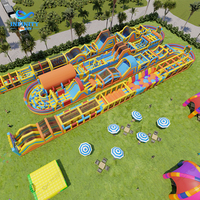 Parc d'attractions gonflable commercial personnalisé Infinity pour l'aventure en plein air, parc d'attractions gonflable pour enfants, parc à thème