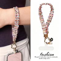 Dragonne de téléphone pour femme avec dentelle, breloque camélia perlée, boucle transparente en D et fente pour cartes, idéale pour les sorties en extérieur