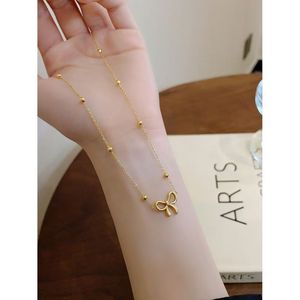 สร้อยคอโชคเกอร์จี้รูปโบว์ผีเสื้อสแตนเลสชุบทอง 18K ดีไซน์หรูหราสำหรับผู้หญิง พร้อมต่างหูและสร้อยข้อมือแบบเชื่อมต่อทันสมัย เป็นของขวัญเครื่องประดับ - Product Image 2