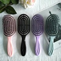2023 boucle personnalisée démêlant brosse à cheveux moderne 12 pagaie peigne forme ovale poils de sanglier rembourré Compact bouclés pagaie Logo personnalisé