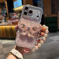 Coque de téléphone à chaîne papillon dégradé avec nœud et coquillage pour iPhone 17 16 15 Pro Max, avec breloques diamantées et lanière scintillante