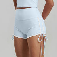 Nouveau short de sport taille haute moulant couleur pêche uni avec cordon de serrage, écologique et respirant pour femme, idéal pour la course, l'entraînement, le fitness et le yoga