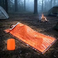 Sac de couchage thermique de survie d'urgence ultra-léger et imperméable pour prévenir la perte de chaleur corporelle