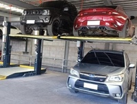 Plateforme élévatrice de stationnement à deux niveaux robuste fabriquée par Maihaisheng pour un stockage sécurisé