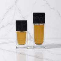 Boîte de parfum en verre vide de luxe personnalisée de haute qualité 30ml 50ml carrée transparente avec bouchon noir et pulvérisateur à pompe, impression sérigraphique