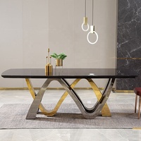 Ensemble de table à manger de conception royale du marché du mobilier de Foshan, moderne, 8 chaises, base en métal doré rose