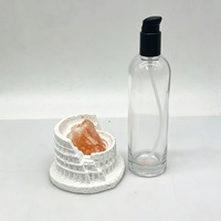 Vente en gros d'usine, flacon en verre transparent rond vide de 170 ml avec pompe à lotion en plastique noir pour sérum, tonique, lotion corporelle
