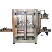 Machine de remplissage entièrement automatique à double tête servo-piston pour liquides, pâtes et semi-fluide, avec suivi de la qualité et 2 buses de remplissage pour détergent lessive
